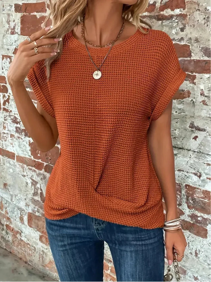 Spring/fall women's waffle knit sweater with short sleeves & a chic front twist. Casual & comfortable.
