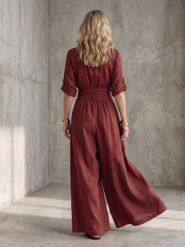 Back view of a red Wanda wide leg jumpsuit, highlighting the elegant one-piece fit.