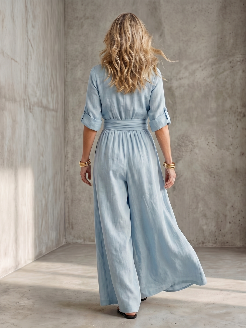 Sky blue Wanda cross front wide leg jumpsuit, showing off the comfortable wide leg design.