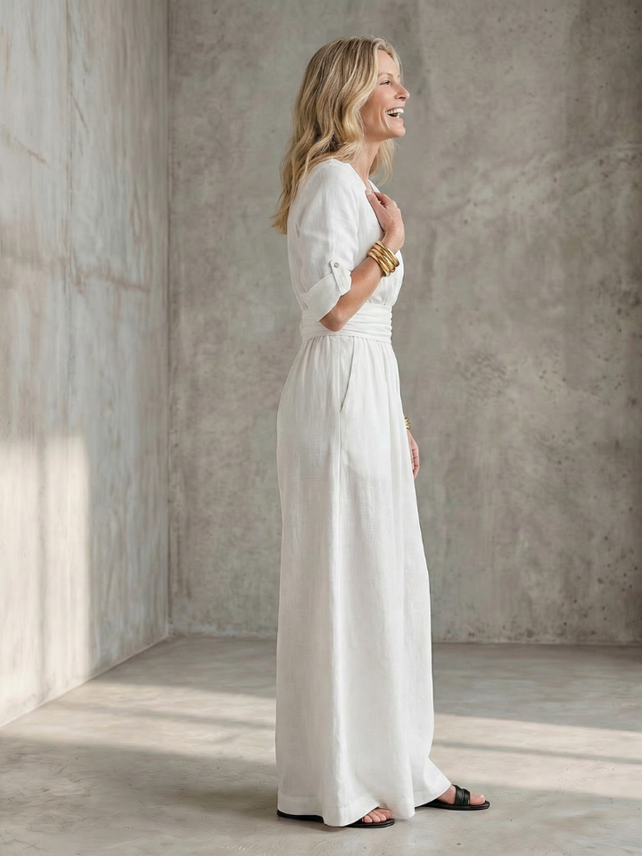 White Wanda wide leg jumpsuit, a chic one-piece with an elegant cross front design.