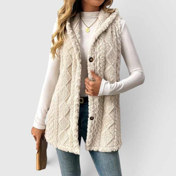Women's warm hooded vest with button front, perfect for winter layering.