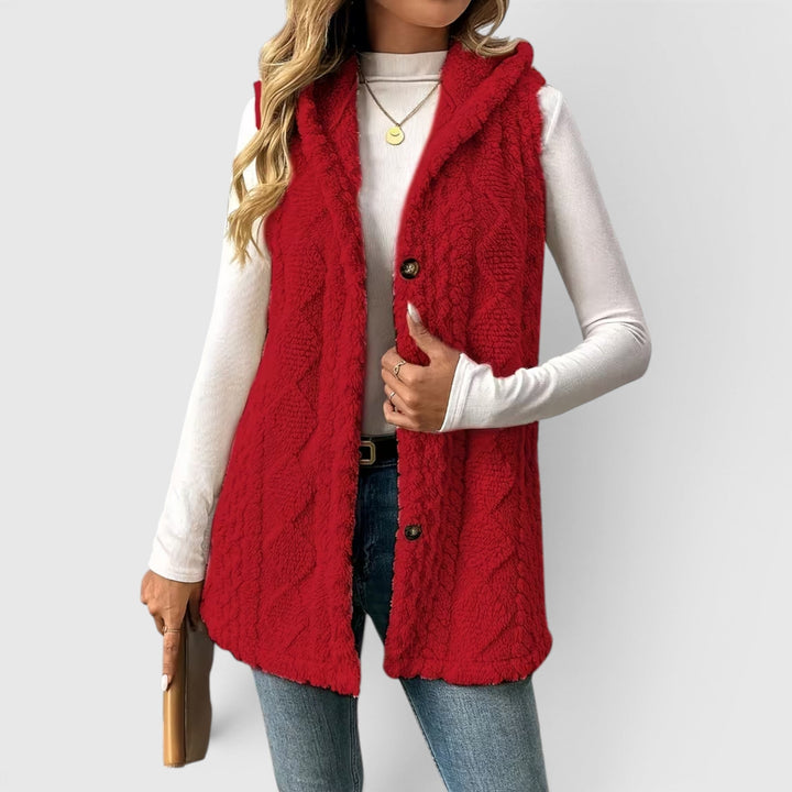 Women's winter fashion vest, warm, hooded, and with elegant button detailing.