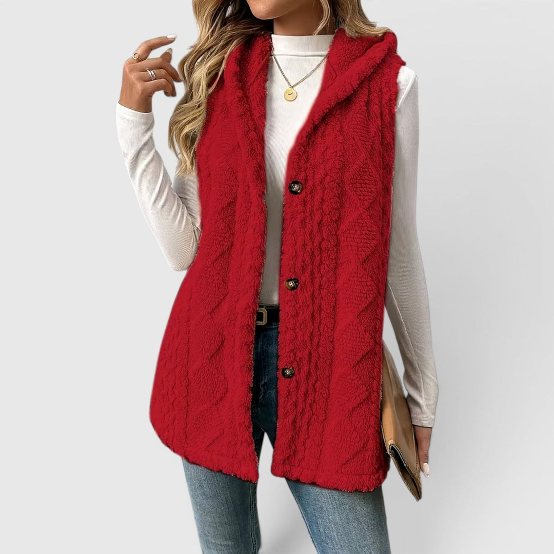 Button-front hooded vest, a soft and warm layering piece for women.