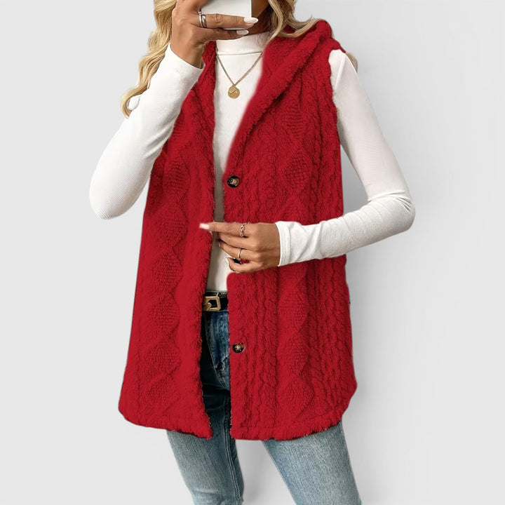Hooded button-front sleeveless jacket for women, perfect for casual outfits.
