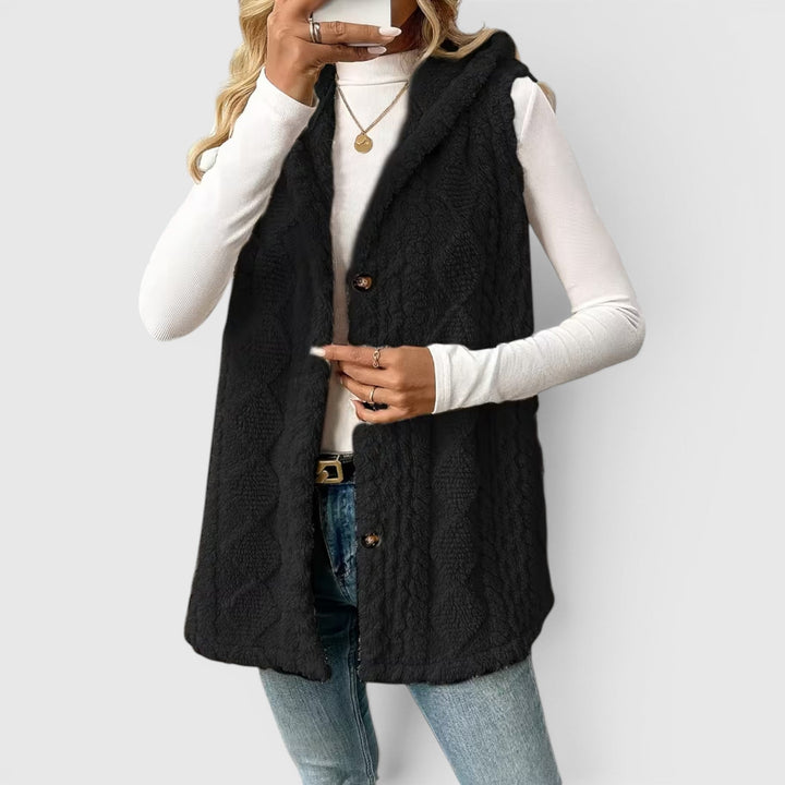 Casual women's hooded vest with button detailing, ideal for autumn comfort.