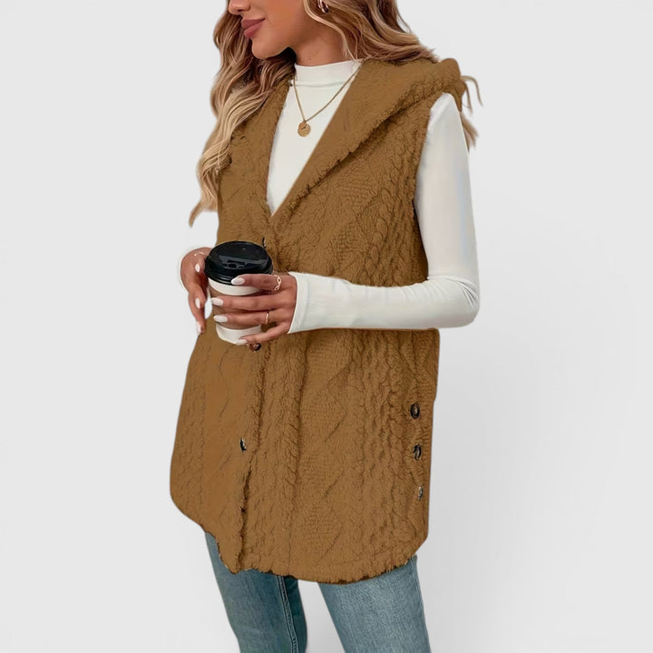 Comfortable women's sleeveless outerwear, hooded and with full button front.