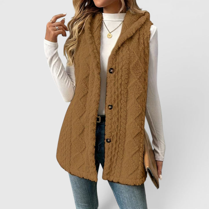 Women's warm autumn vest, button-front design with a cozy hood.