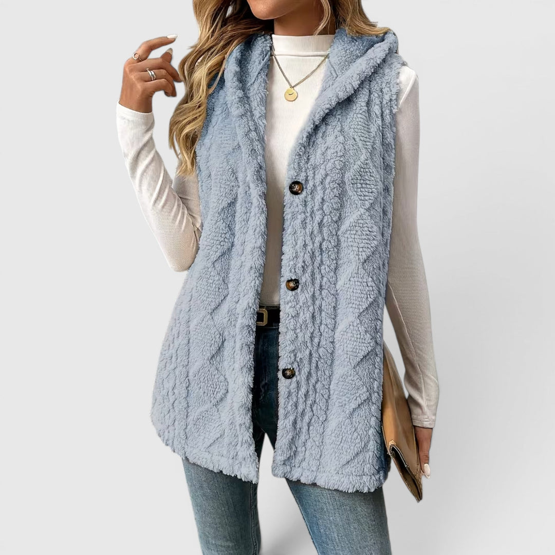 Cozy women's hooded vest with front buttons, great for layering in fall.
