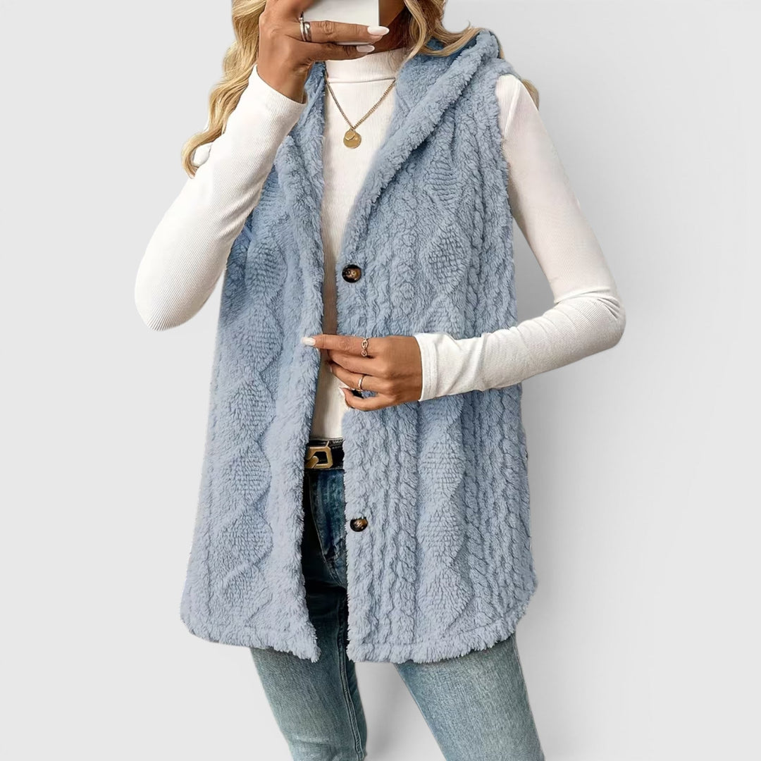 Women's comfortable hooded sleeveless vest, featuring front button closure.
