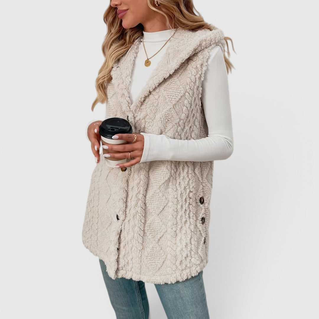 Chic women's sleeveless jacket, warm and versatile, with button closure and hood.