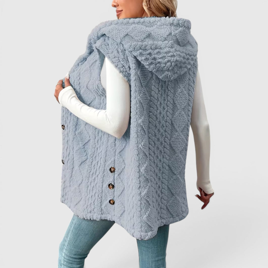 Autumn-ready women's button-front hooded vest, a warm layering essential.