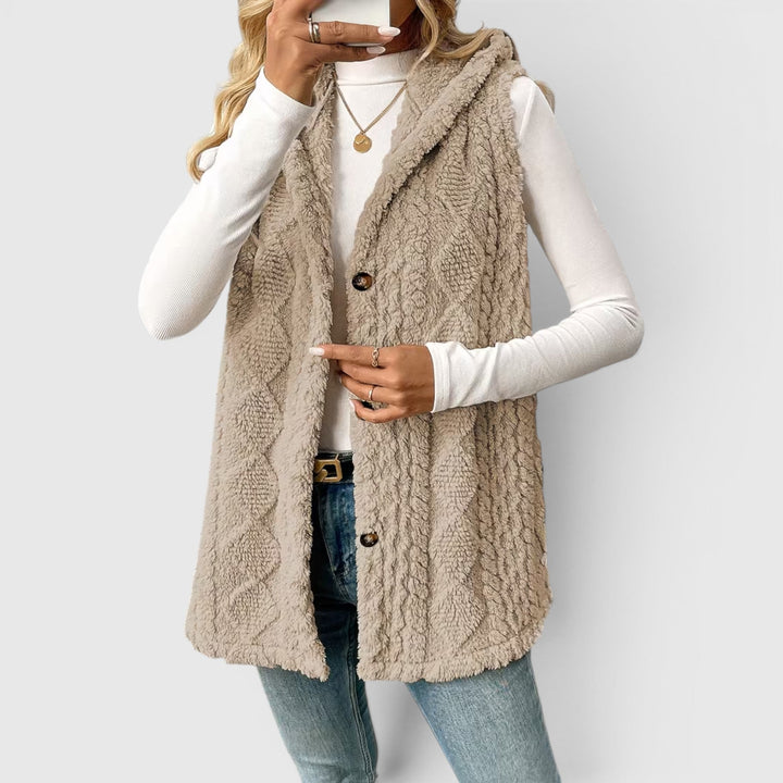 Cozy women's hooded vest with buttons, ideal for autumn and winter fashion.