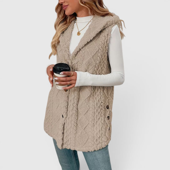 Stylish women's sleeveless jacket, button-front hooded design for warmth.