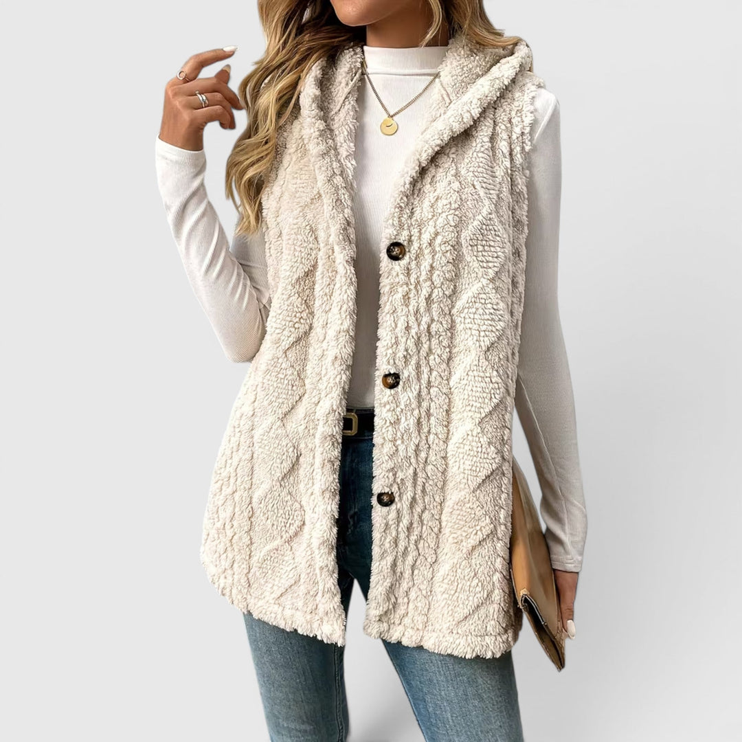 Warm women's hooded vest featuring a stylish button front for cozy layering.