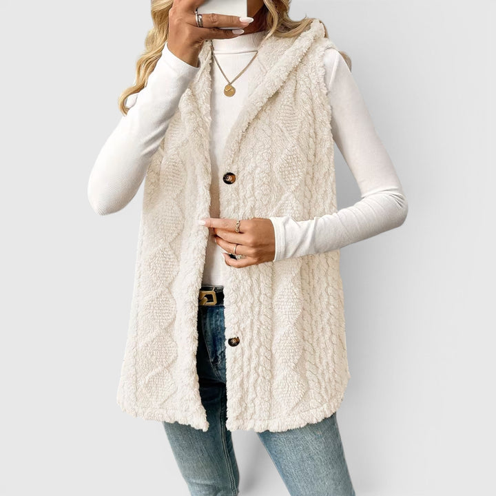 Comfortable women's warm vest, hooded and buttoned, a perfect layering piece.