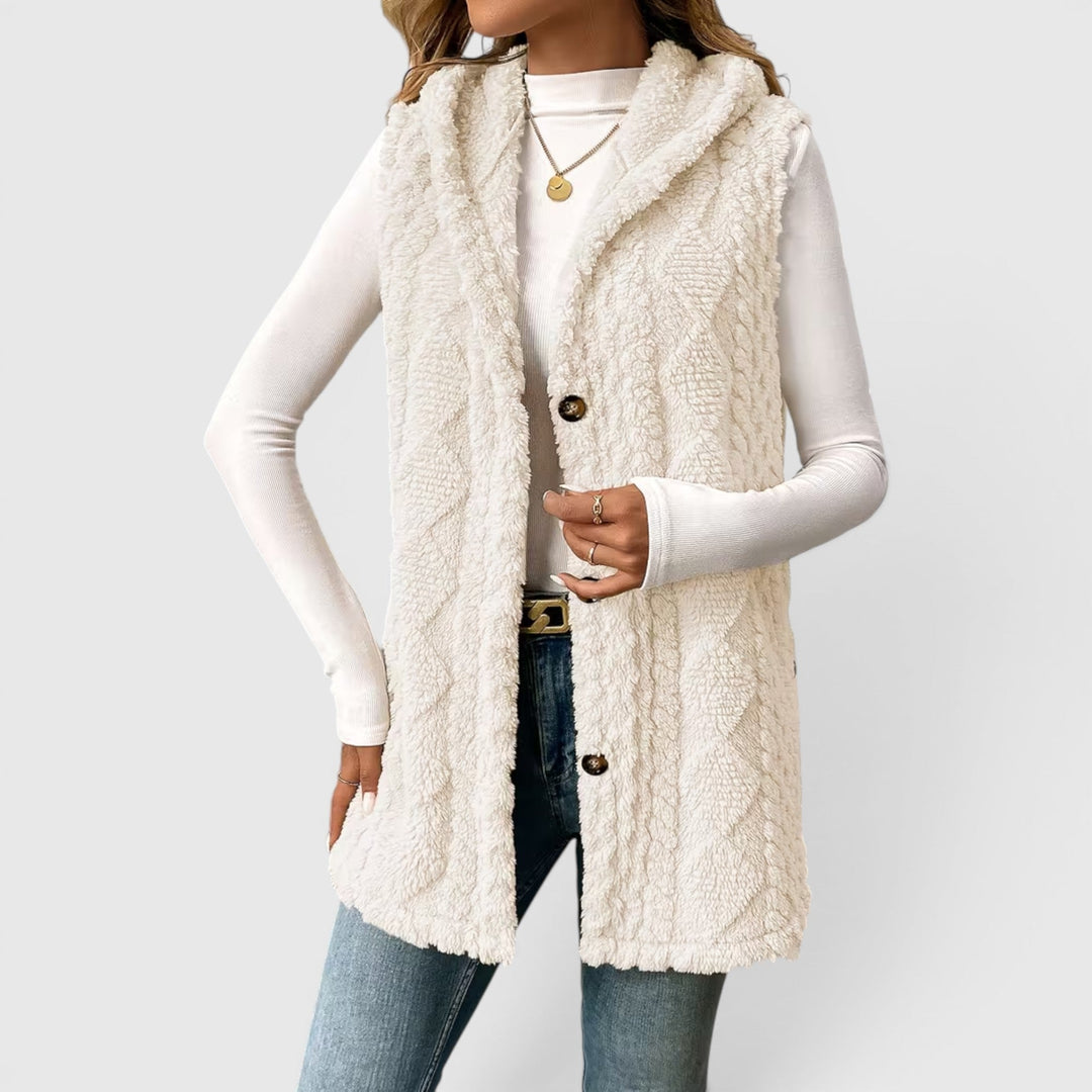 Stylish women's warm outerwear: button-front hooded vest for chilly days.