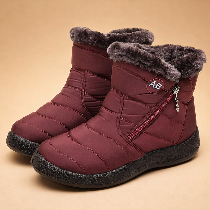 Slip-on women's winter ankle boots with warm lining, ideal for comfortable casual cold weather wear.