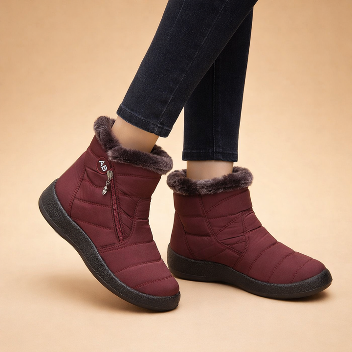 Stylish women's warm lined ankle boots, offering comfortable casual cold weather protection and easy slip-on wear.