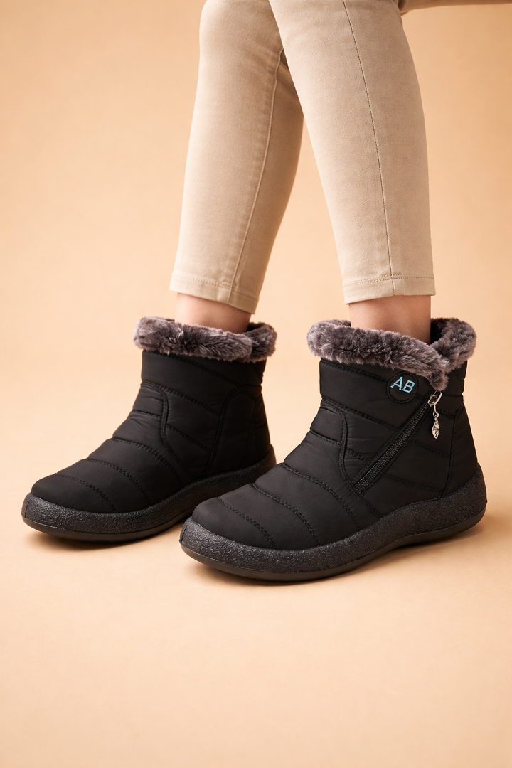 Women's warm lined winter boots, comfortable slip-on footwear for cold weather and casual style.