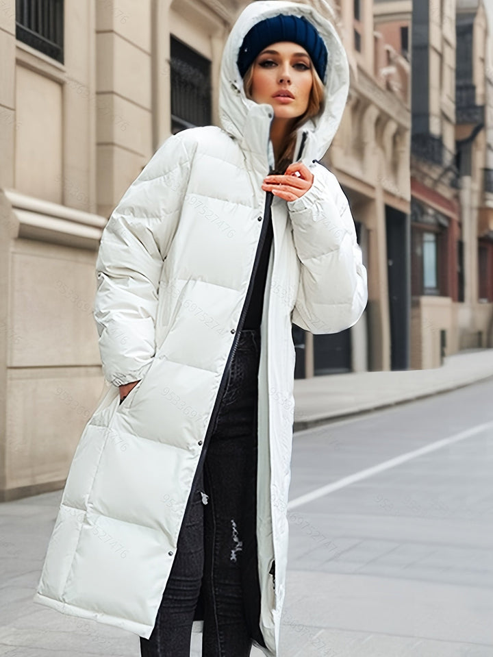 Women's warm long padded coat with hood, perfect for winter comfort and stylish outerwear.
