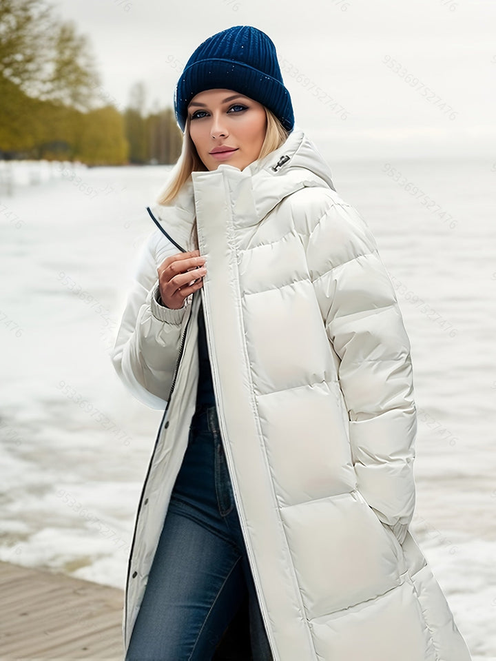 Modern women's long padded winter outerwear, a warm and stylish hooded jacket for autumn comfort.