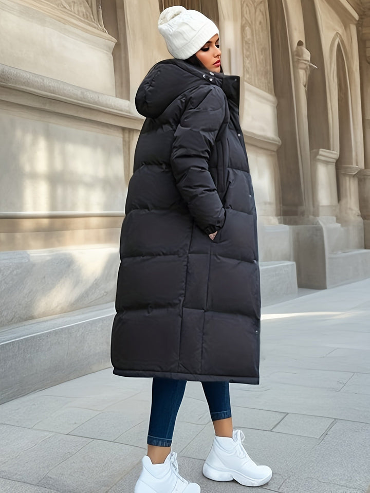 Versatile women's long padded coat, a warm hooded jacket designed for winter comfort and autumn style.