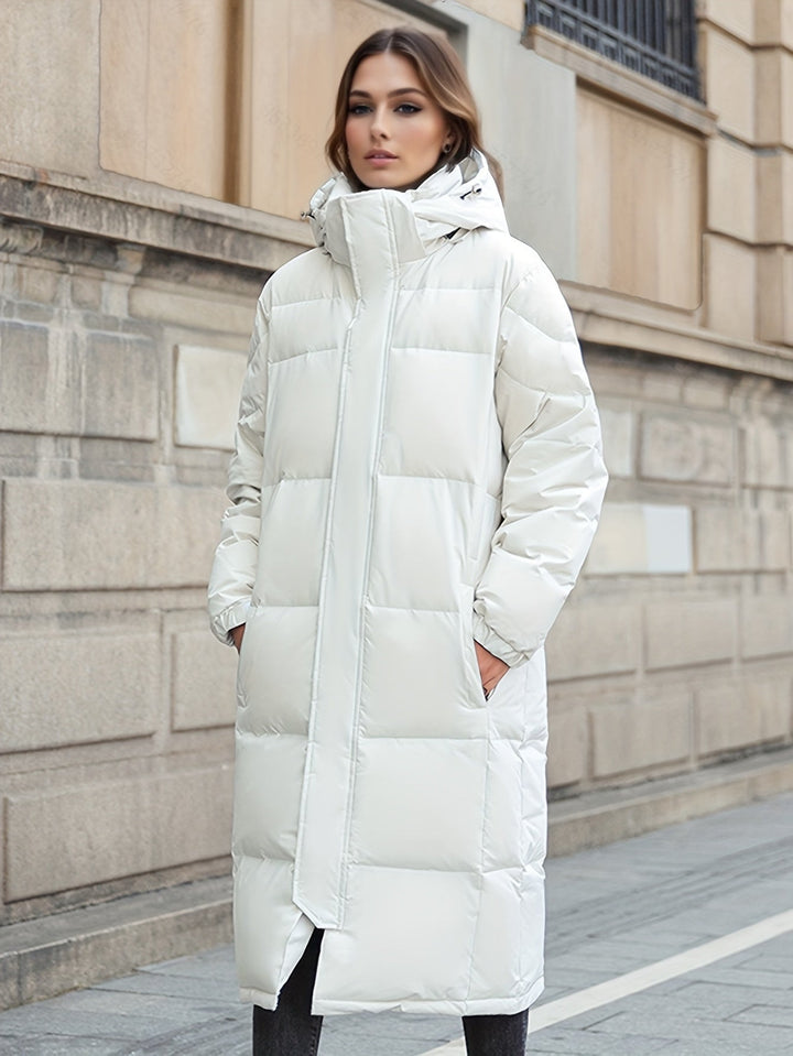 Full-length women's long padded coat, a hooded winter jacket providing ultimate warmth and comfort.