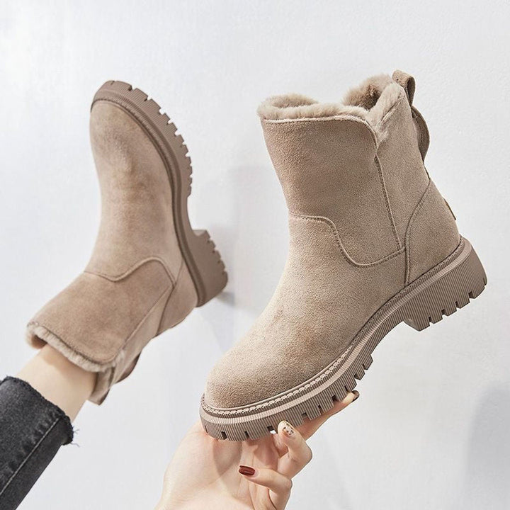 Women's warm slip-on ankle boots with cozy lining & chunky platform sole for ultimate winter comfort.
