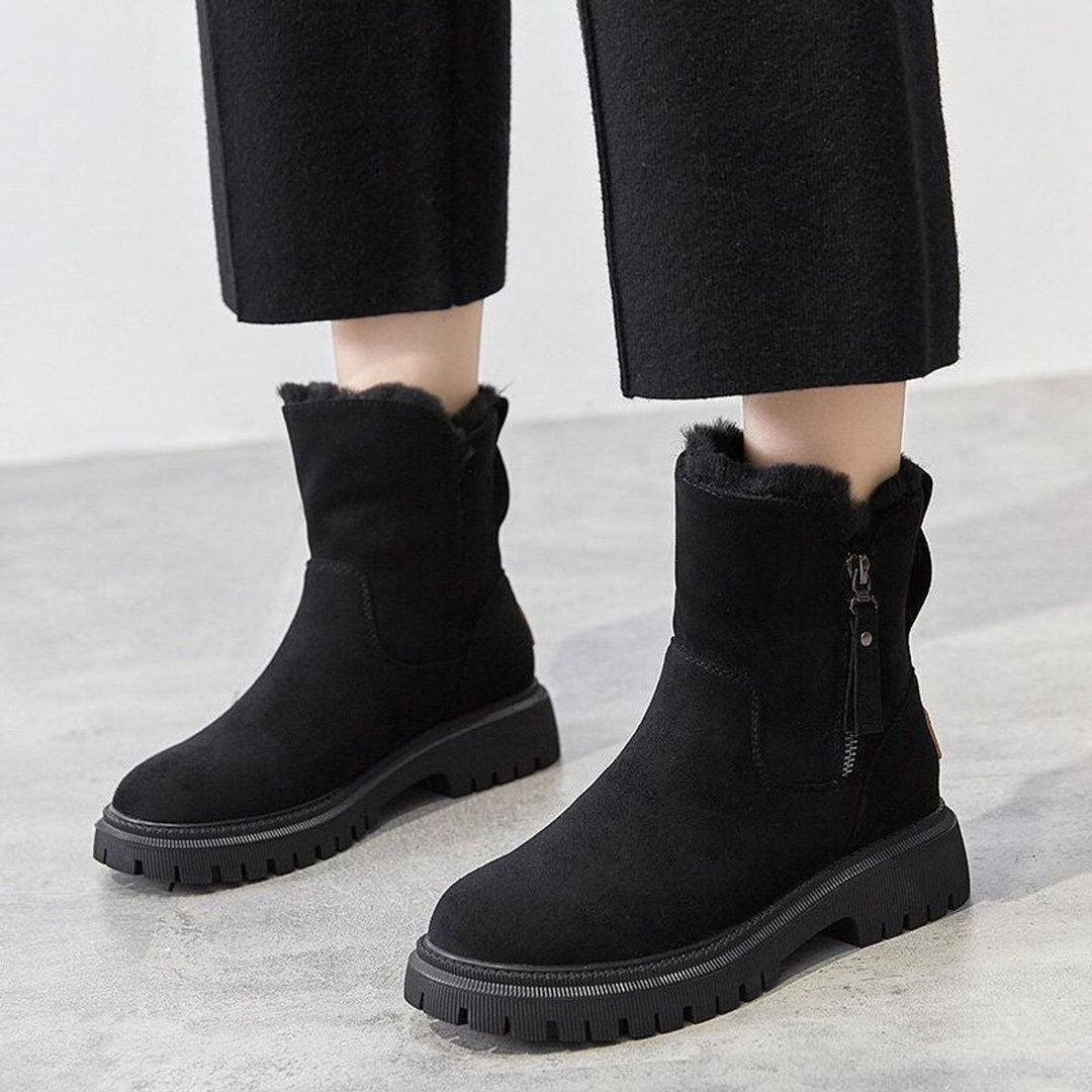 Cozy women's winter slip-on boots featuring warm plush lining & a durable grip sole for comfort & safety.