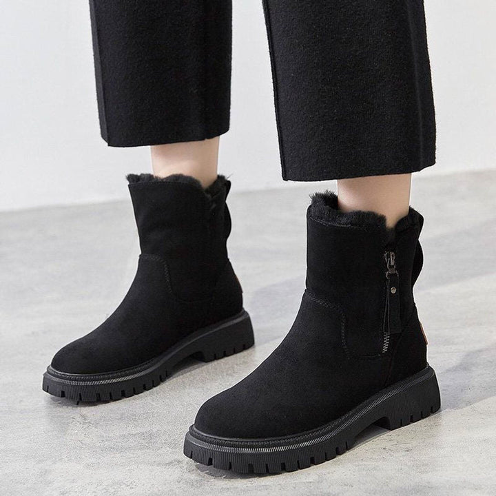 Cozy women's winter slip-on boots featuring warm plush lining & a durable grip sole for comfort & safety.