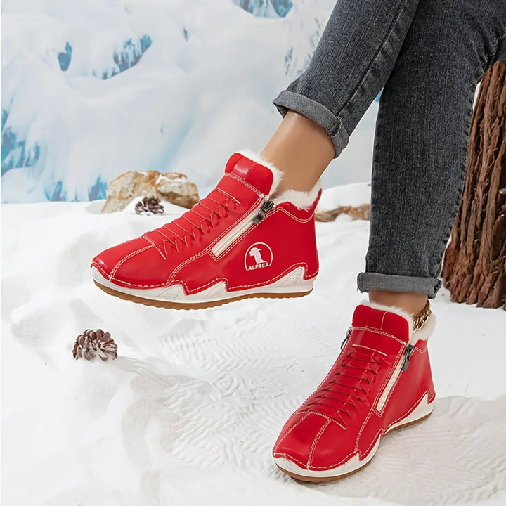 Practical women's snow boots with easy zip-up access and plush faux-fur for warmth.