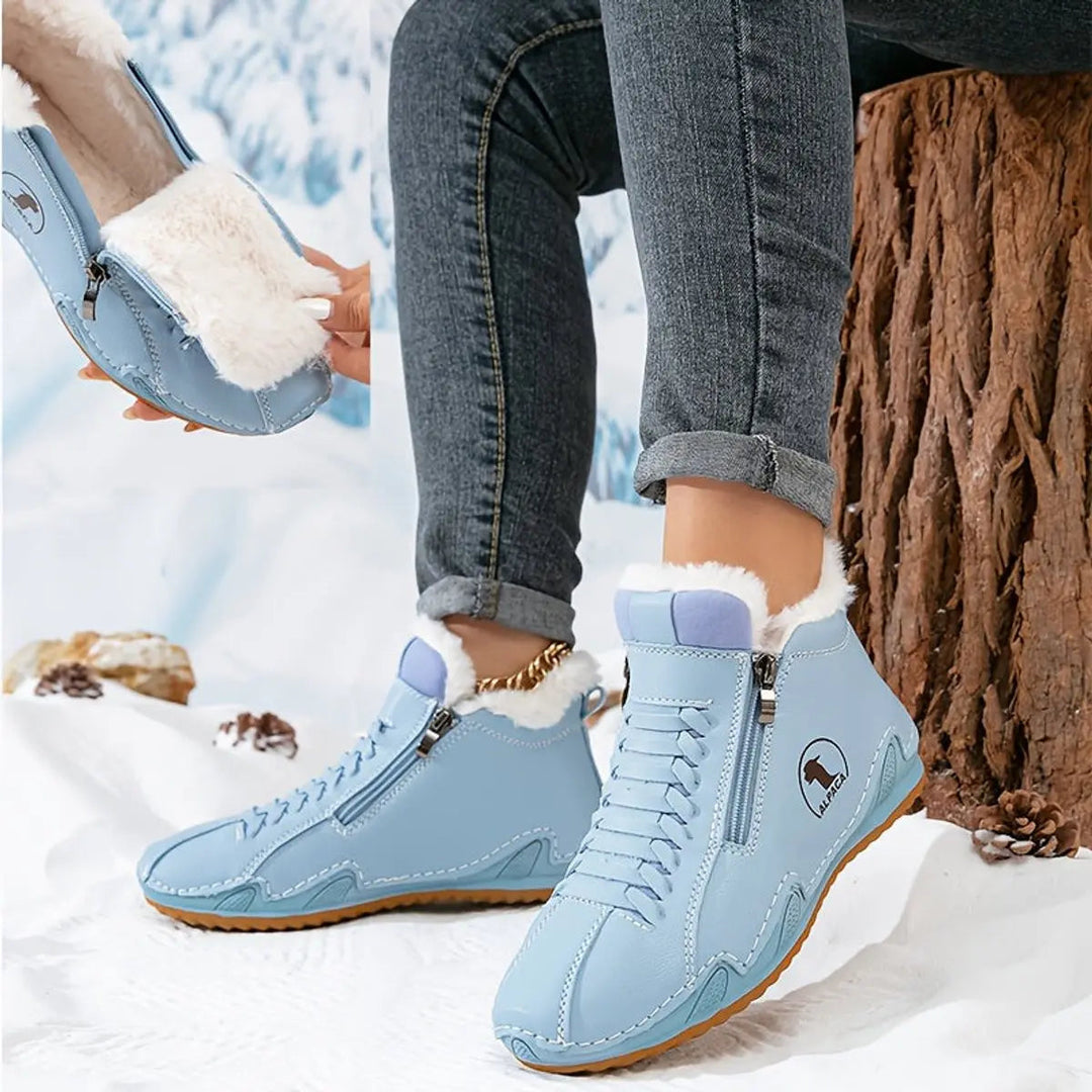 Wide fit women's ankle boots, warm faux-fur lining, and convenient zip for winter durability.