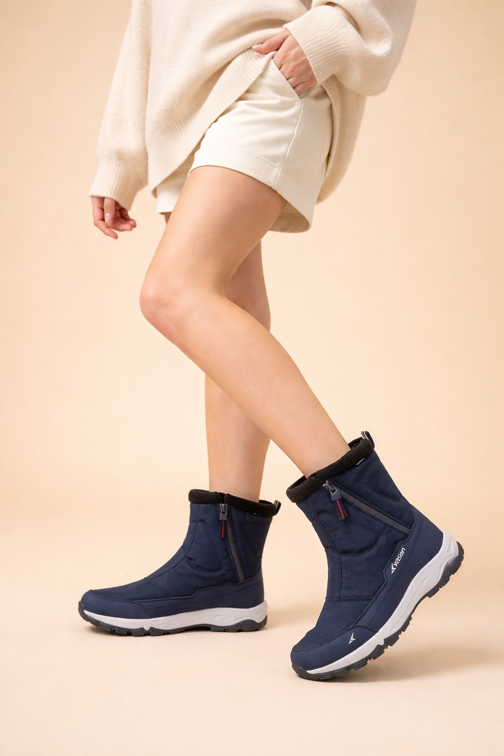 Fashionable women's winter boots with practical side zip, ready for snow, offering warmth and sturdy grip.
