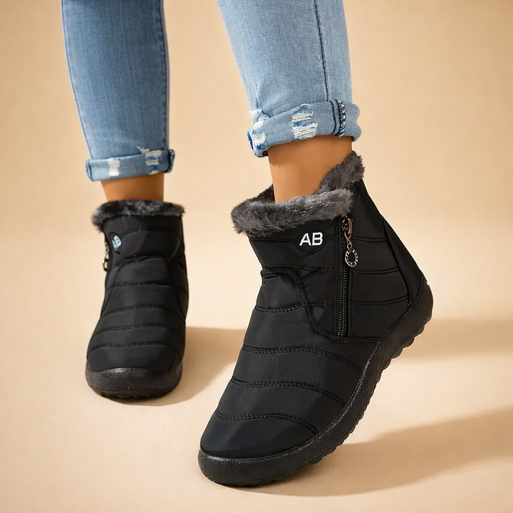 Stylish women's zip-up ankle boots, providing warmth & comfort for snowy winter days. Fashionable cold-weather footwear.