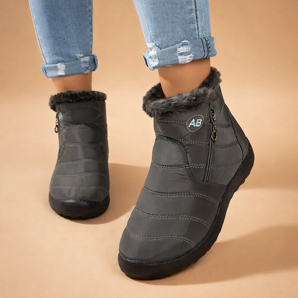 Durable women's warm ankle boots, ideal for cold winter conditions. Easy zip-up design for cozy, convenient wear.