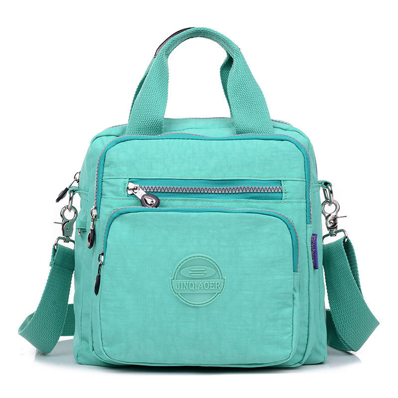 Secure women's water-resistant travel crossbody bag, protecting valuables during daily commutes.