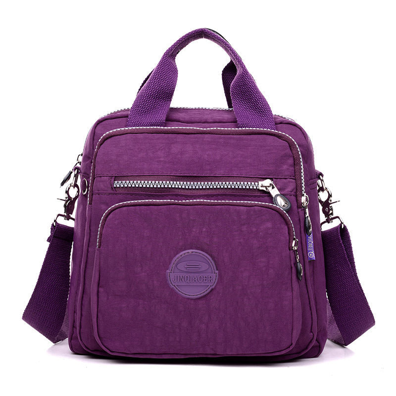 Compact travel accessory: women's water-resistant crossbody bag for secure, hands-free journeys.
