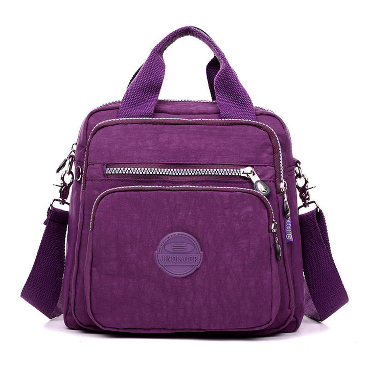 Compact travel accessory: women's water-resistant crossbody bag for secure, hands-free journeys.