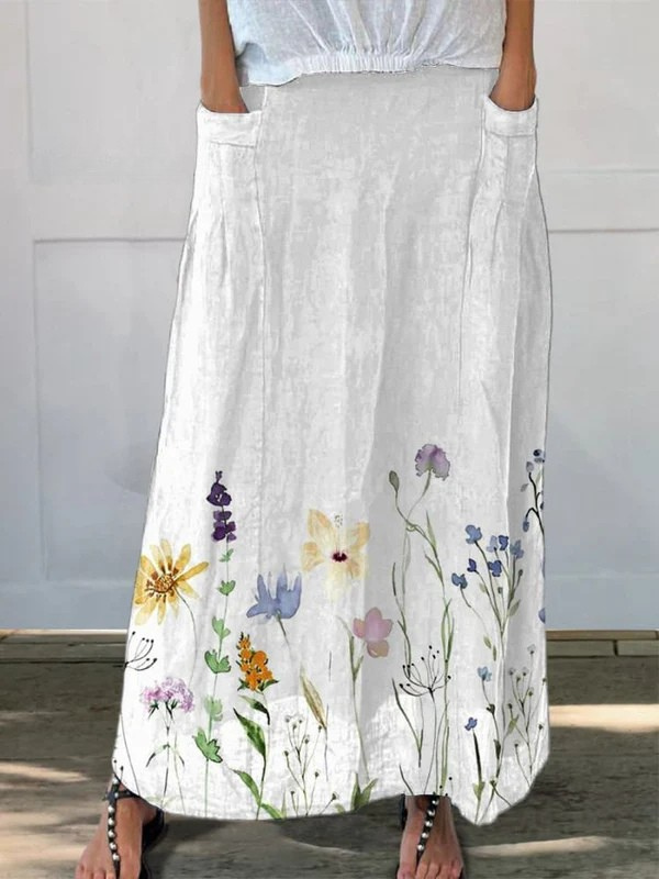 Women's watercolor floral midi skirt with pockets, an elegant A-line design for spring & summer comfort.