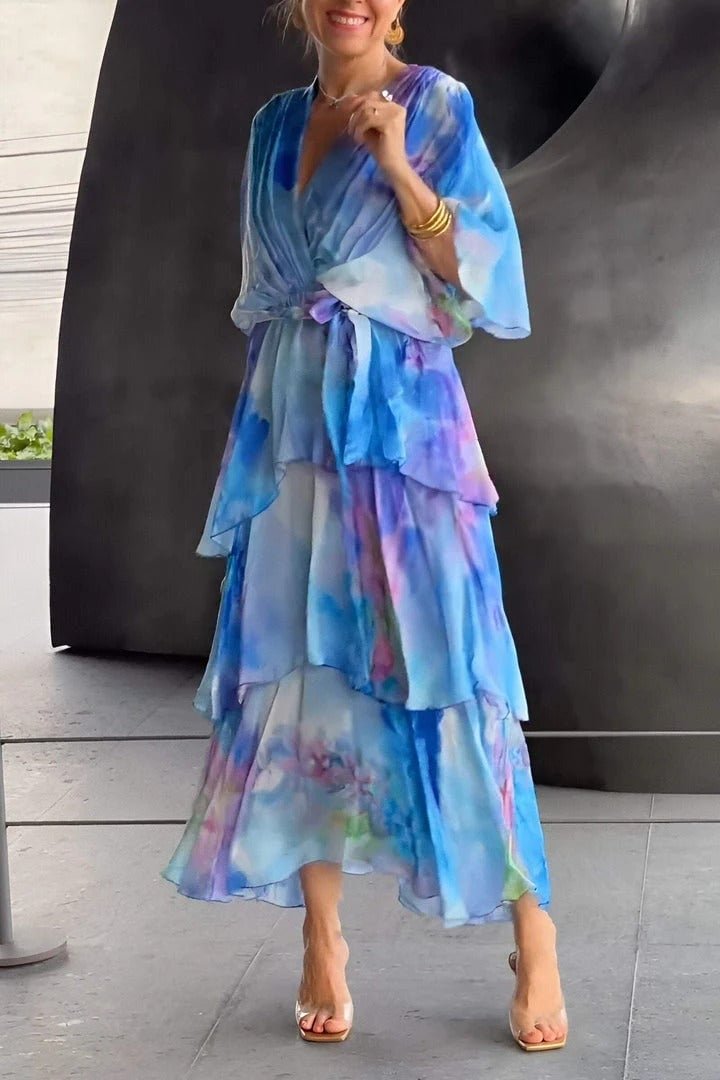 Women's watercolour floral tiered maxi dress, elegant flowing chiffon style for summer events.