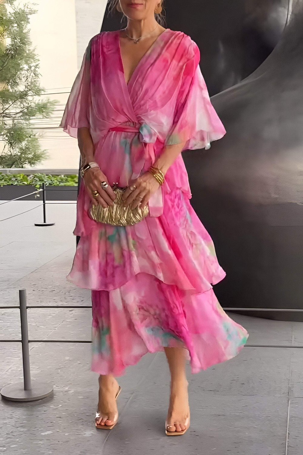 Elegant women's tiered maxi dress with watercolour floral print, perfect bohemian chiffon summer party wear.