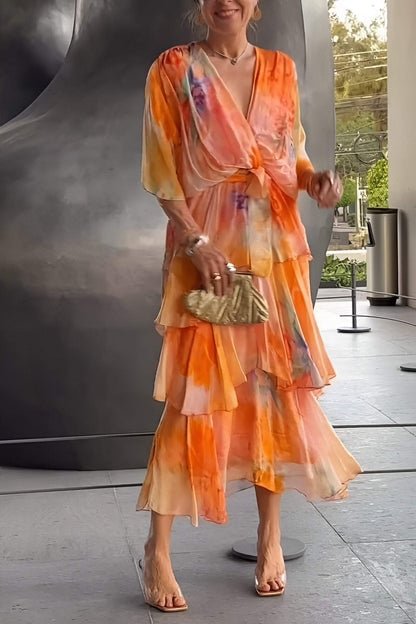 Flowing chiffon women's maxi dress, featuring a beautiful watercolour floral tiered design, ideal for events.