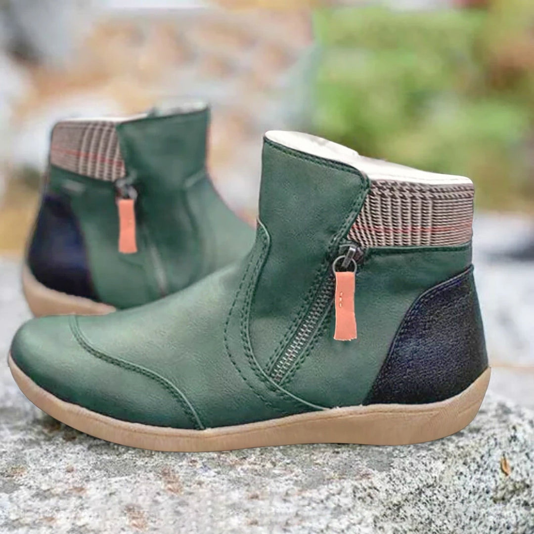 Women's waterproof ankle boots with side zip closure, designed for comfort & everyday weatherproof wear.