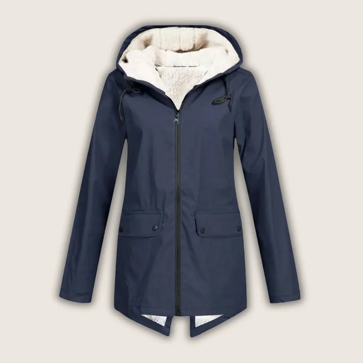 Stylish women's waterproof rain jacket, hooded, featuring practical front pockets, perfect for casual wear.