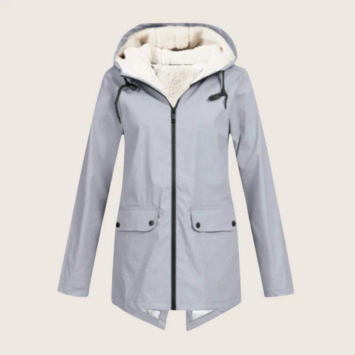 Versatile women's all-weather hooded jacket, waterproof, with utility front pockets for outdoor adventures.