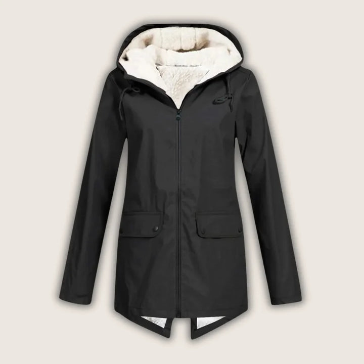 Casual women's waterproof hooded jacket with spacious front pockets, great for everyday wear and light rain.