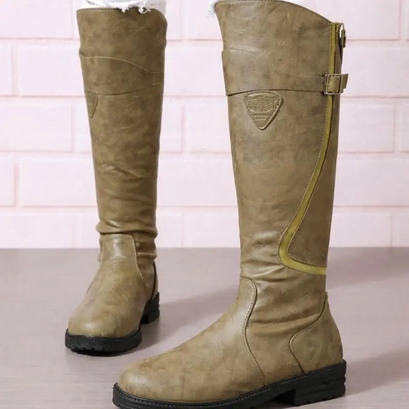Durable women's waterproof knee-high boots with side zip, designed for reliable weather resistance.