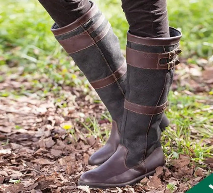 Women's waterproof knee-high pull-on country boots, ideal for equestrian and all-weather wear. Durable and chic.