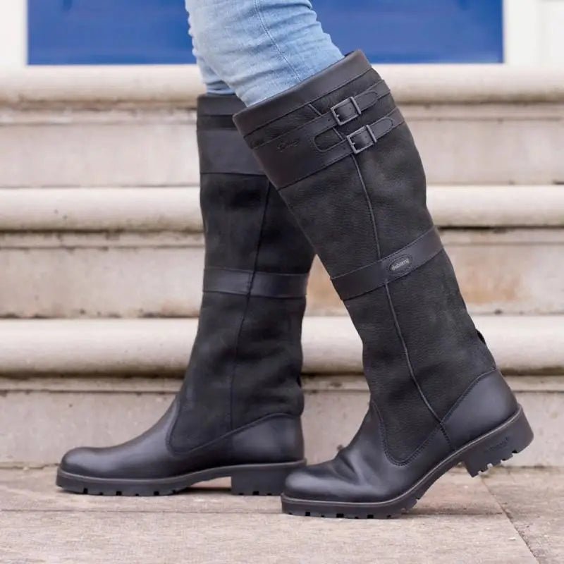 Comfy women's waterproof knee-high country boots with pull-on design. Perfect for equestrian or outdoor activities.