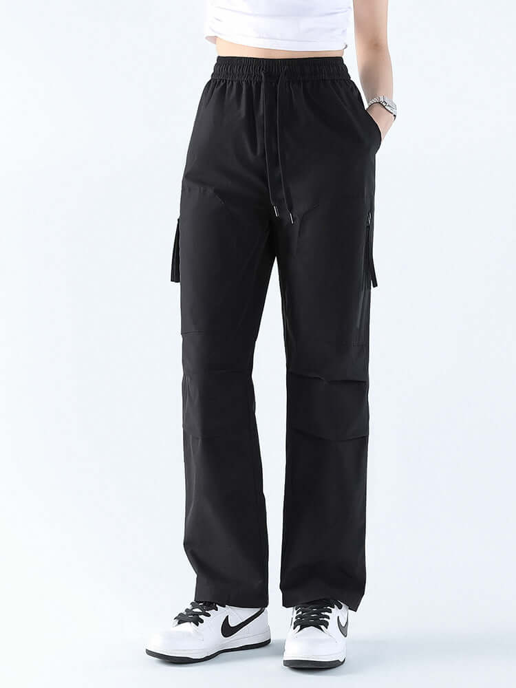 Versatile women's waterproof hiking pants, loose fit straight leg for comfortable outdoor and travel wear.